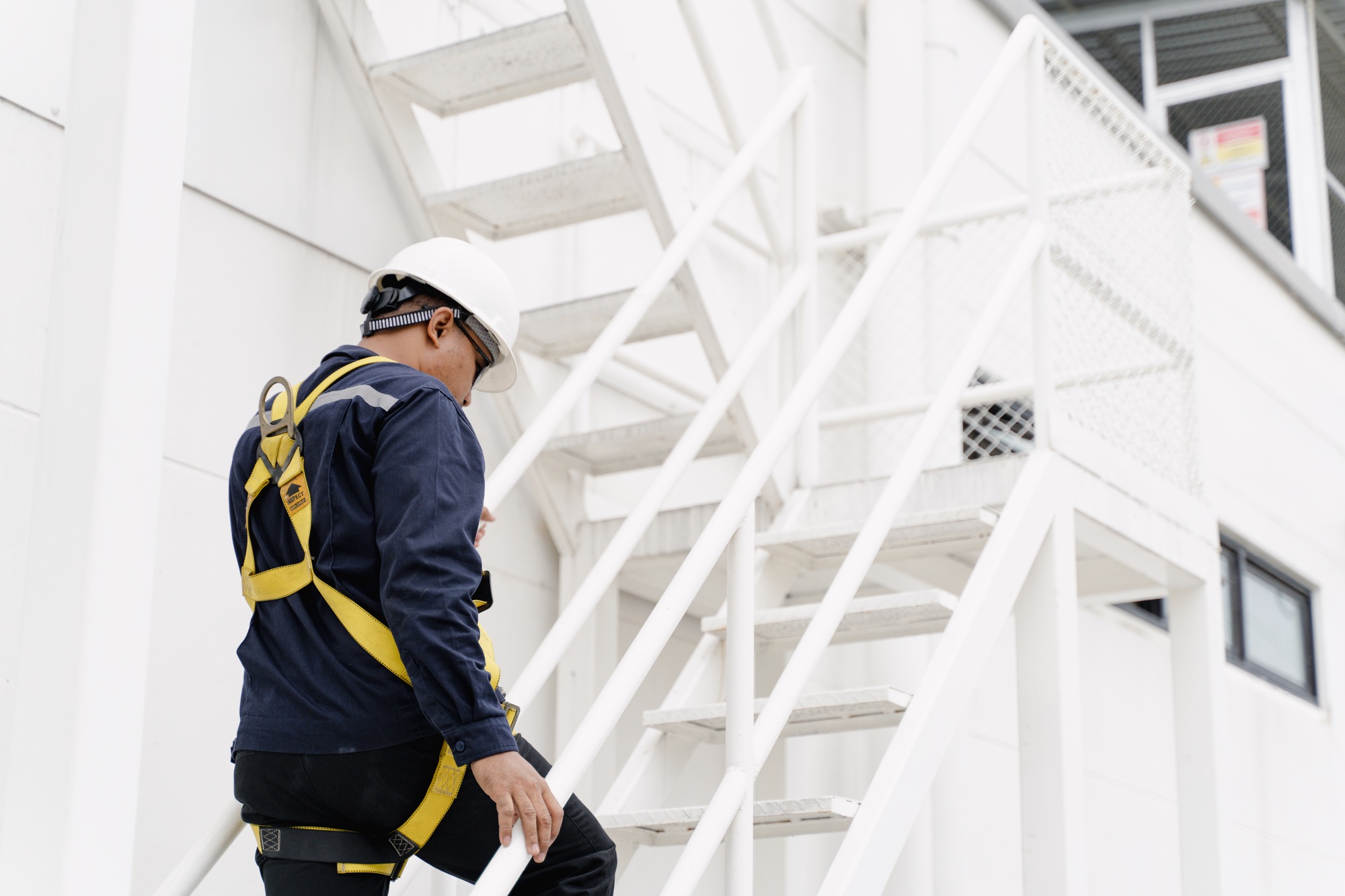 Close up of maintenance man working on site, maintenance man with building.